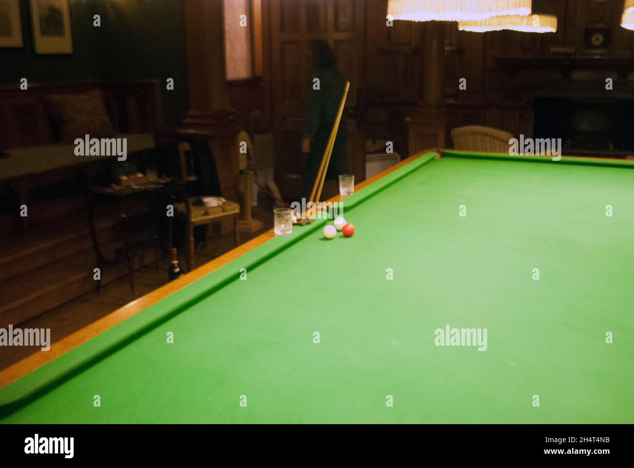 Billiards / Snooker table with three billiard balls and cue inside