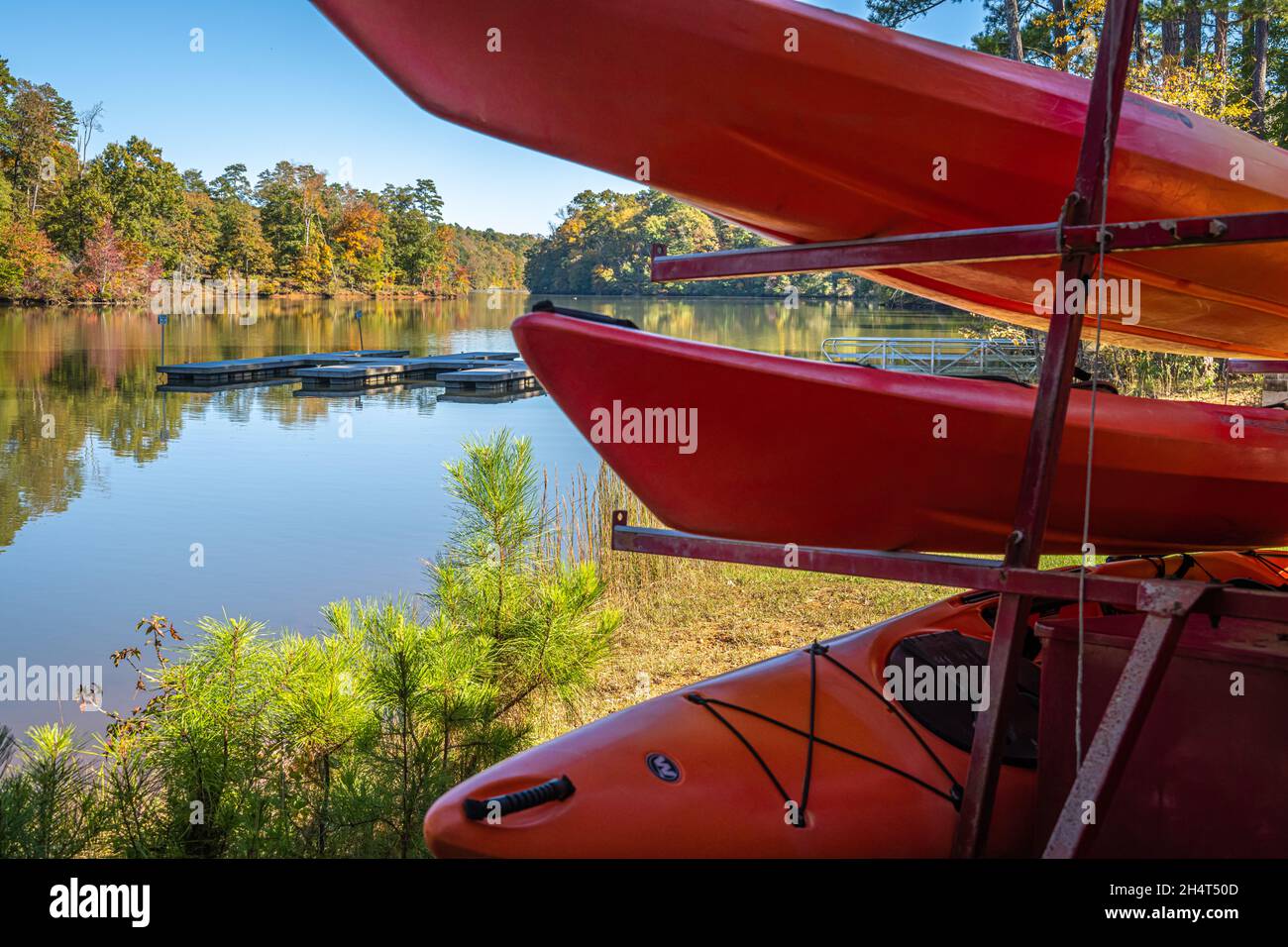 Colorful autumn landscape with rental kayaks at Don Carter State Park on Lake Lanier in Gainesville, Georgia. (USA) Stock Photo