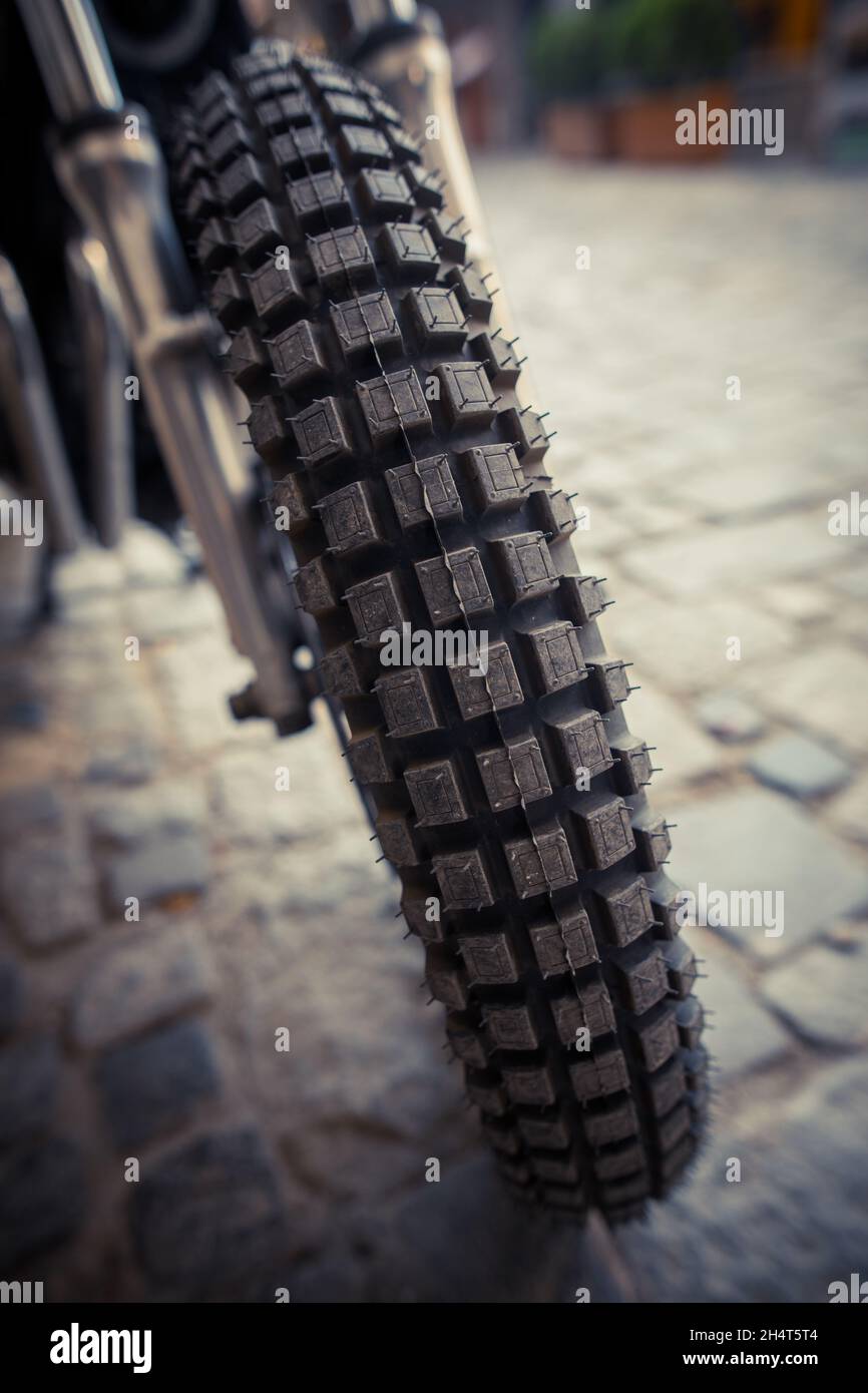 Close up shot of a motocross motorcycle enduro knobby tire Stock Photo -  Alamy