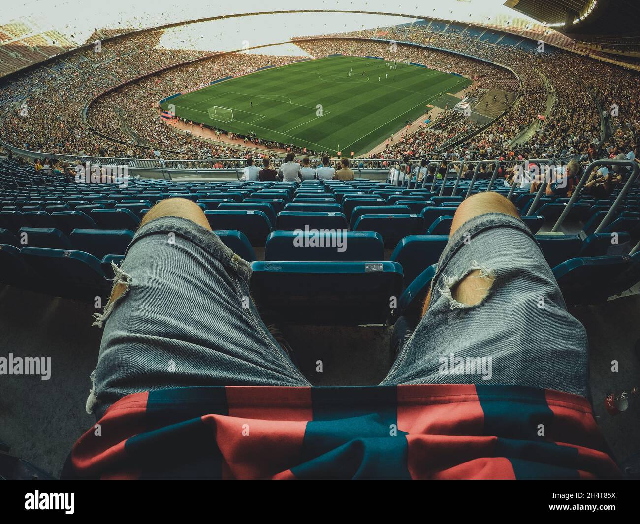 Fan legs with football stadium on the background Stock Photo Alamy