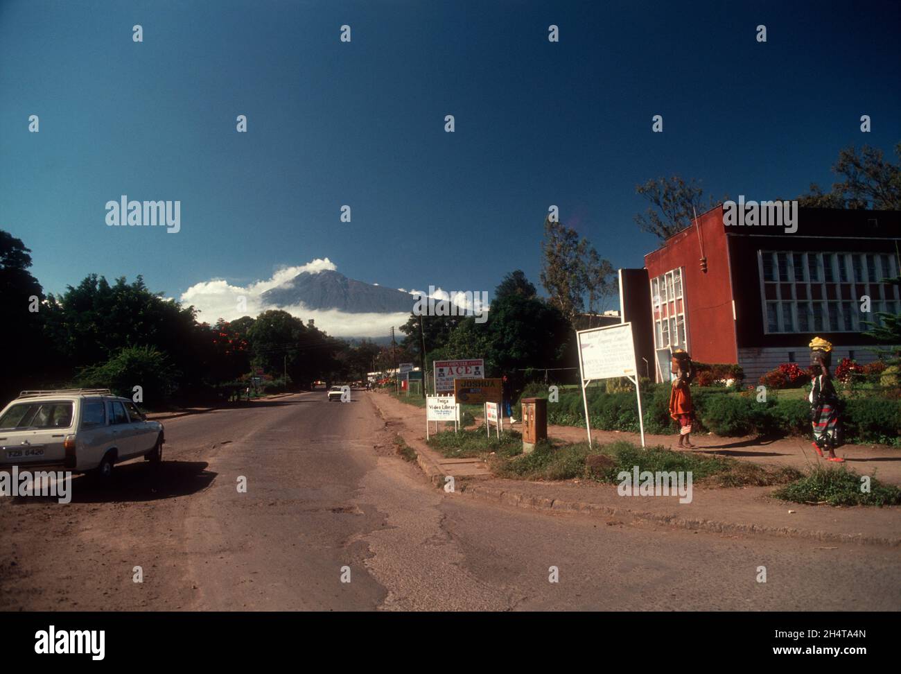 Mount Meru in the distance, as seen from Arusha town, Tanzania Stock Photo