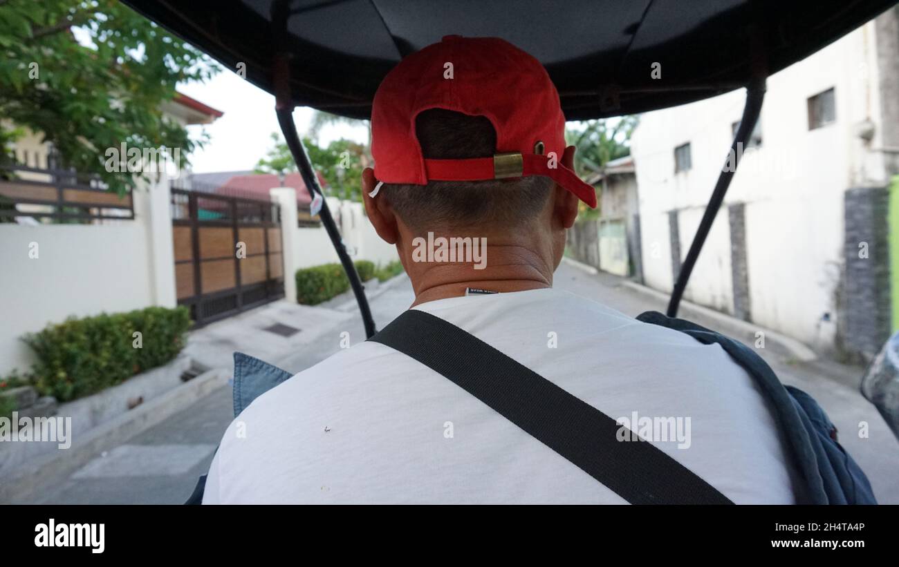 Tricycle driver in Laguna, Philippines Stock Photo