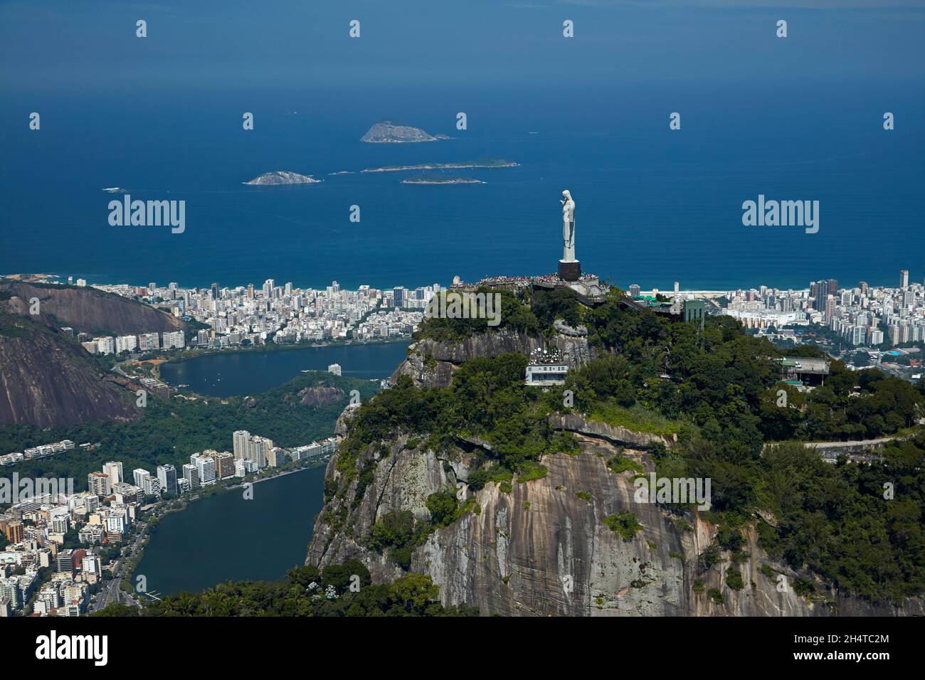 Christ the Redeemer atop Corcovado, Rodrigo de Freitas Lagoon, and Atlantic Ocean, Rio de Janeiro, Brazil, South America - aerial Stock Photo