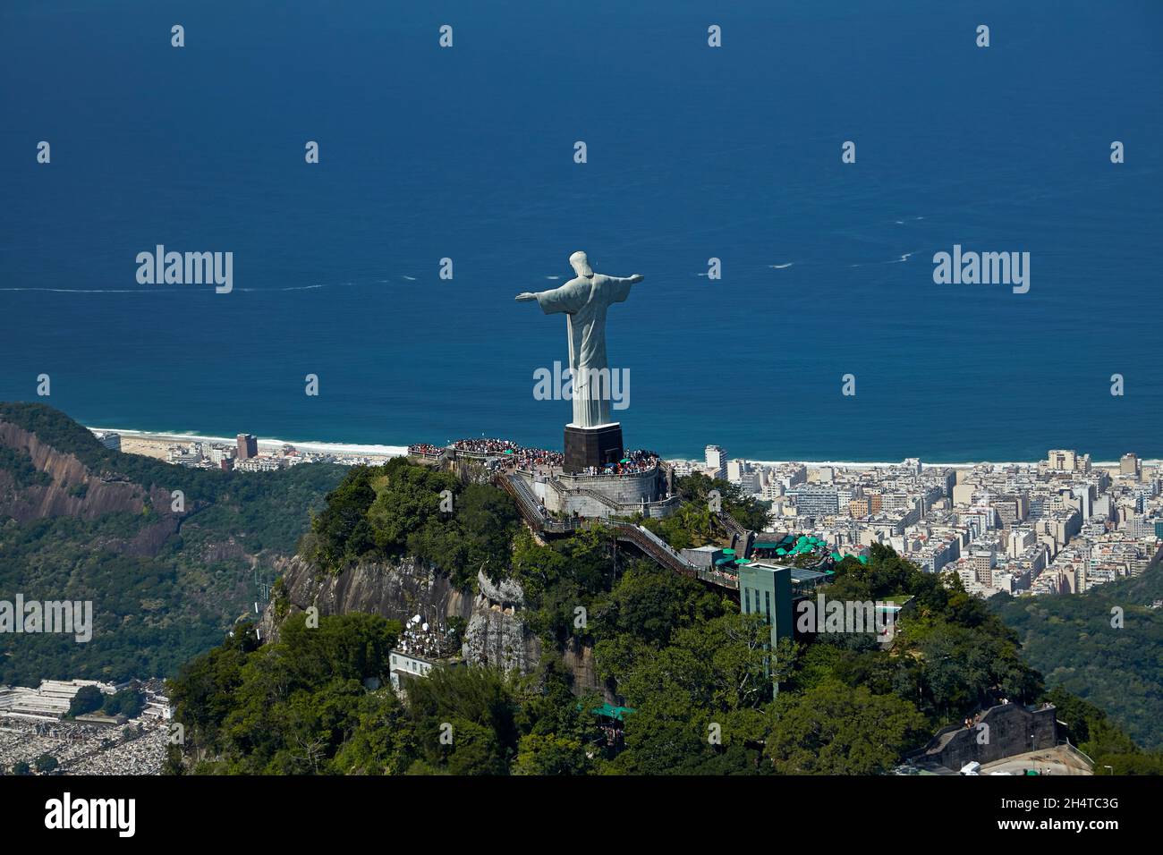 Christ the Redeemer atop Corcovado, and Atlantic Ocean, Rio de Janeiro, Brazil, South America - aerial Stock Photo