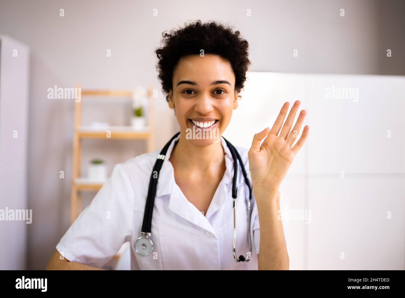 African Nurse Or Doctor Using Video Conference Stock Photo