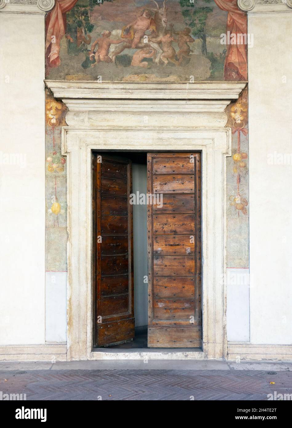 Wooden doorway and frescoes at Villa Giulia, Rome, 2021. Stock Photo