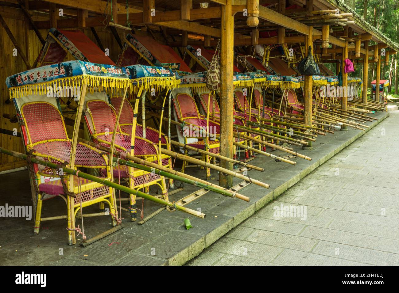 A line of sedan chairs for carrying tourists in Zhangjiajie National ...