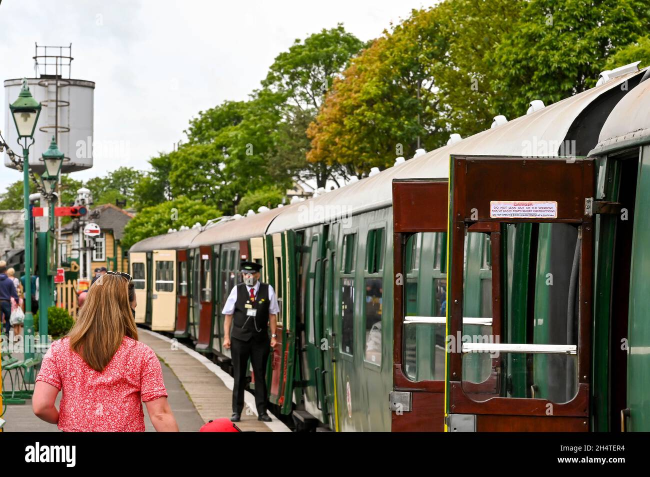 Swanage England June 2021 People About To Get On A Vintage Steam swanage-england-june-2021-people-about-to-get-on-a-vintage-steam