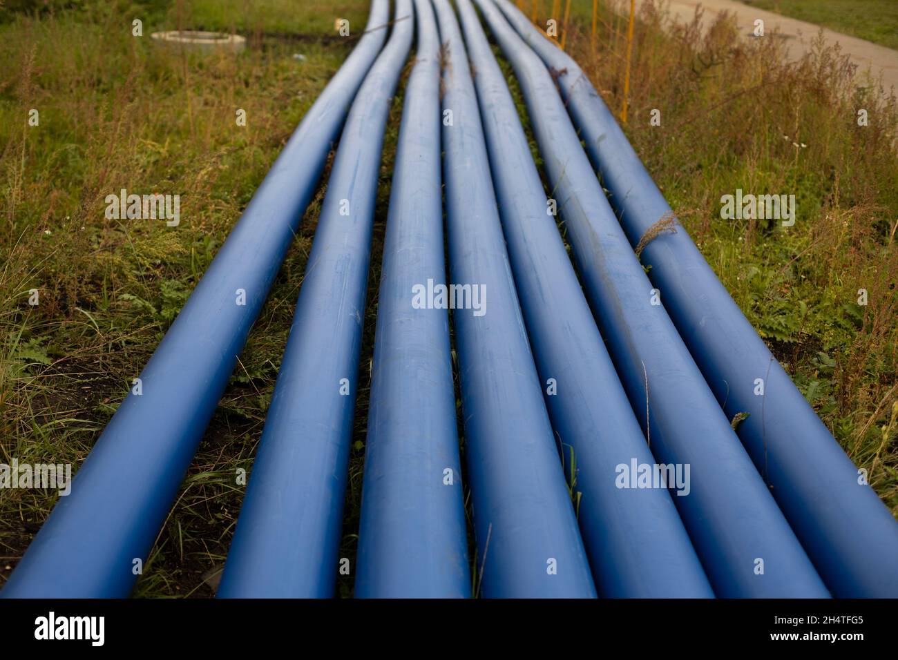 Blue plastic pipes. Flexible pipes for sewerage. Laying of heating