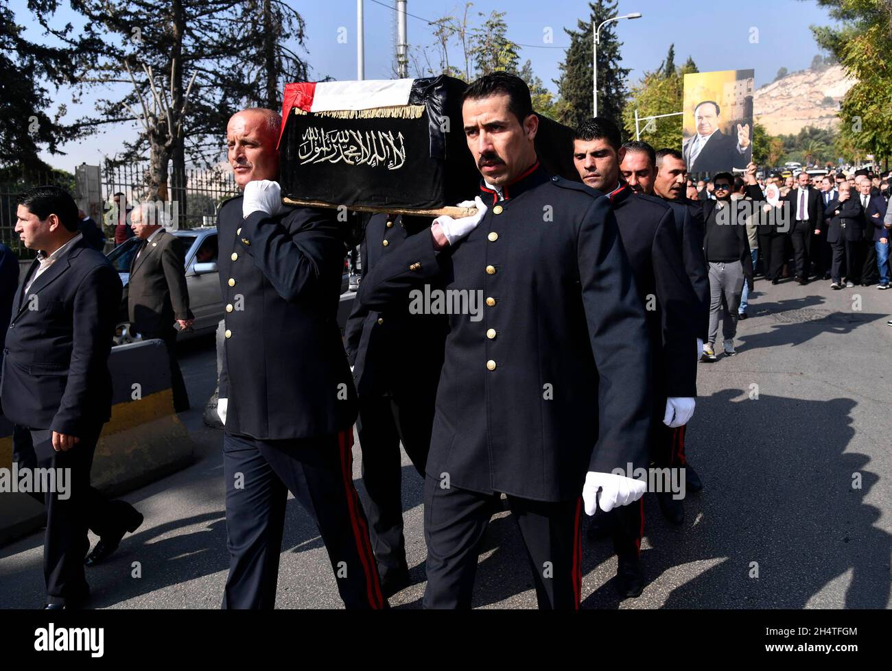 Damascus, Syria. 4th Nov, 2021. Honor guards carry the casket of late Syrian singer Sabah Fakhri during his funeral procession in Damascus, Syria, on Nov. 4, 2021. Fakhri, an iconic tenor singer from Syria's northern province Aleppo, died on Tuesday at the age of 88 at a hospital in the capital Damascus. Credit: Ammar Safarjalani/Xinhua/Alamy Live News Stock Photo