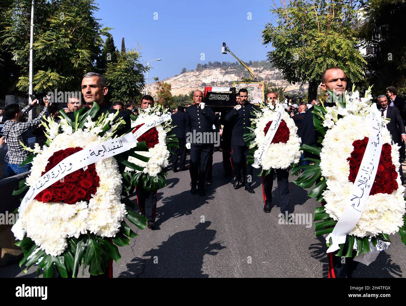 Damascus, Syria. 4th Nov, 2021. Honor guards carry the casket of late Syrian singer Sabah Fakhri during his funeral procession in Damascus, Syria, on Nov. 4, 2021. Fakhri, an iconic tenor singer from Syria's northern province Aleppo, died on Tuesday at the age of 88 at a hospital in the capital Damascus. Credit: Ammar Safarjalani/Xinhua/Alamy Live News Stock Photo