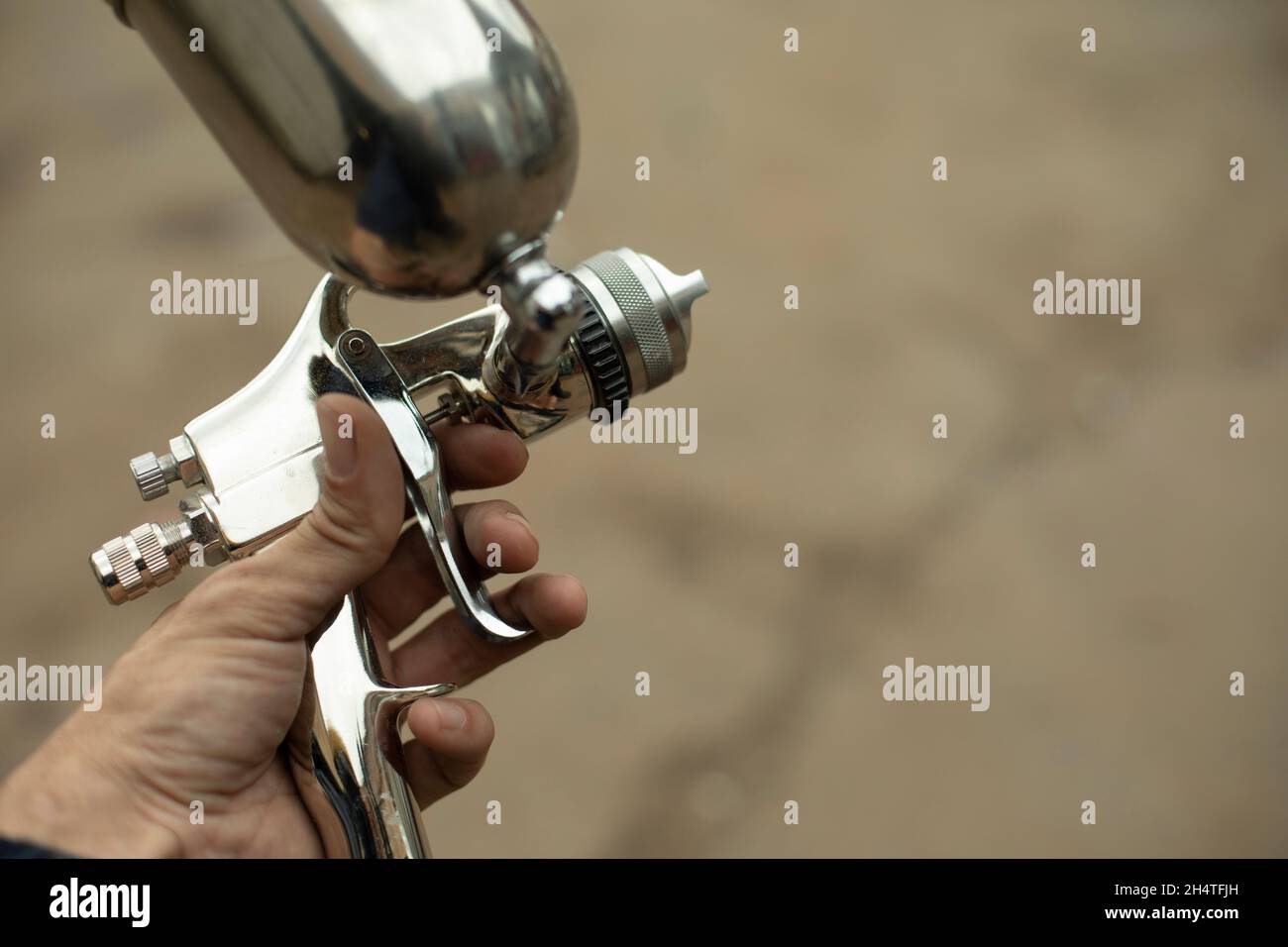 Paint sprayer. Tools for air and liquid paint. Chromeplated steel