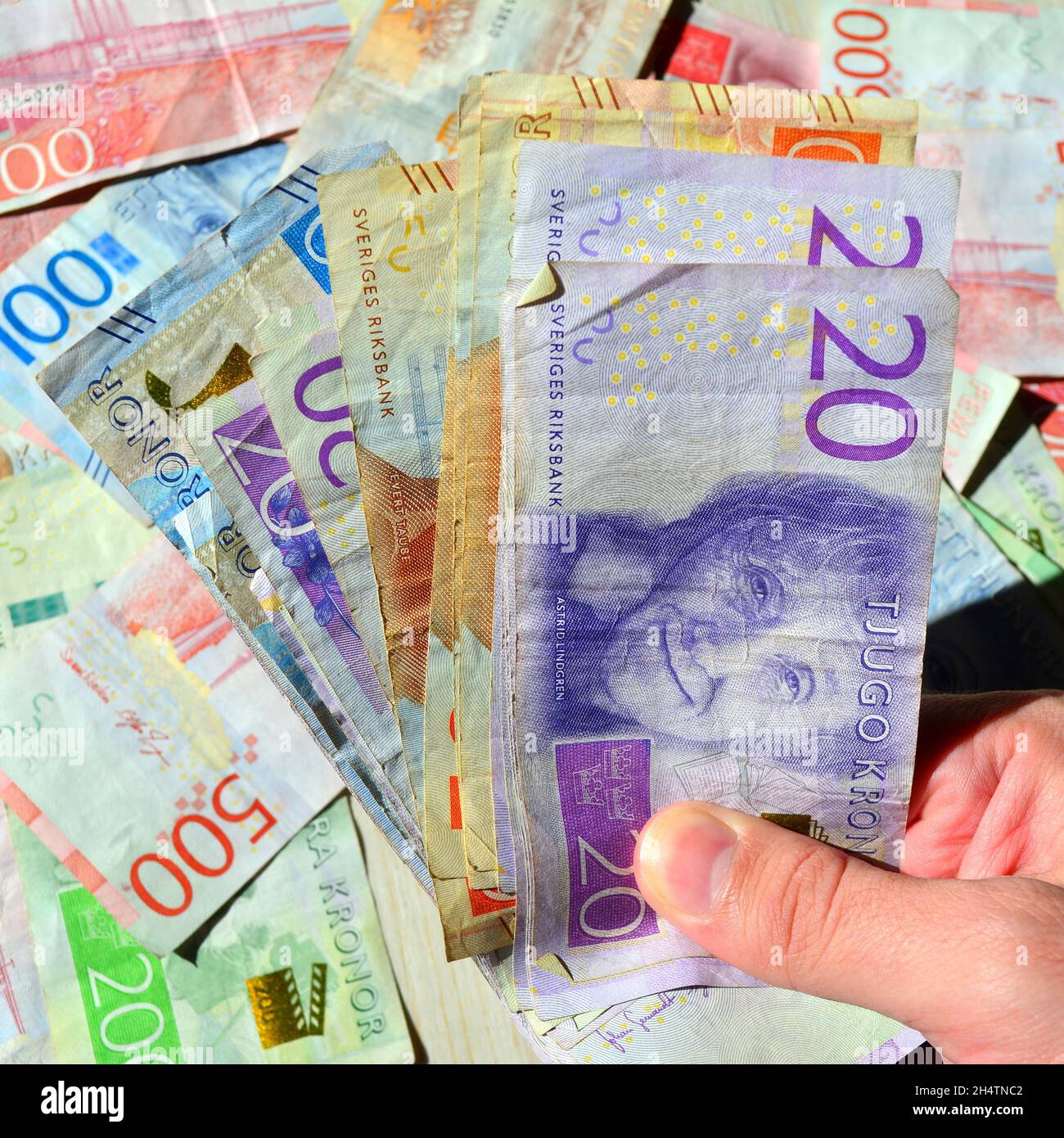 Hand holding swedish krona banknotes hi-res stock photography and ...