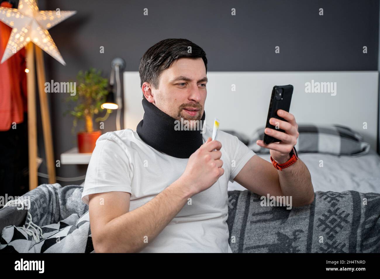 Topic online consultation with doctor. Man with neck collar complains