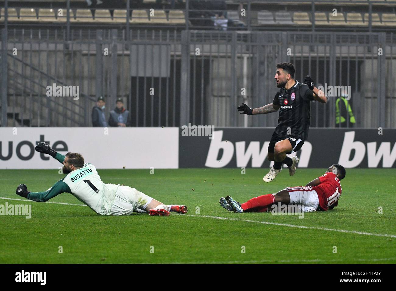 ZAPORIZHZHIA, UKRAINE - NOVEMBER 4, 2021 - Forward Allahyar Sayyadmanesh (C) of FC Zorya Luhansk celebrates upon scoring the second goal in added time as he gets past goalkeeper Gustavo Busatto (L) and defender Bradley Mazikou (R) of PFC CSKA-Sofia during the 2021/2022 UEFA Europa Conference League Matchday 4 Group C game at the Slavutych Arena, Zaporizhzhia, southeastern Ukraine. Stock Photo