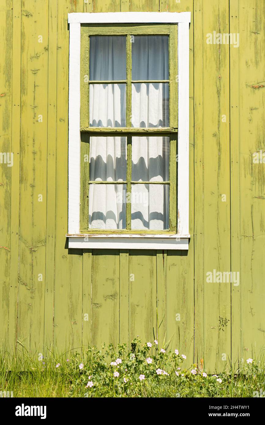 Old green window on barn Stock Photo