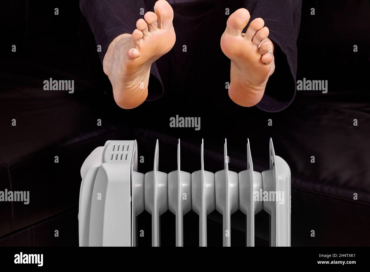 Household oil heater and male feet above it Stock Photo Alamy