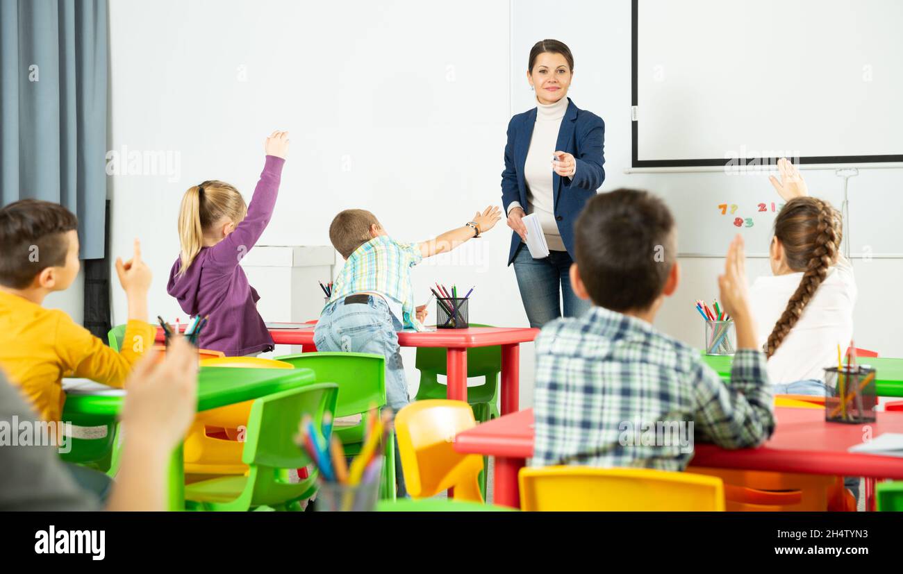 Conduct lessons. Conduct lessons. Woman and man teacher out building. Conduct lessons. Conduct a lesson.