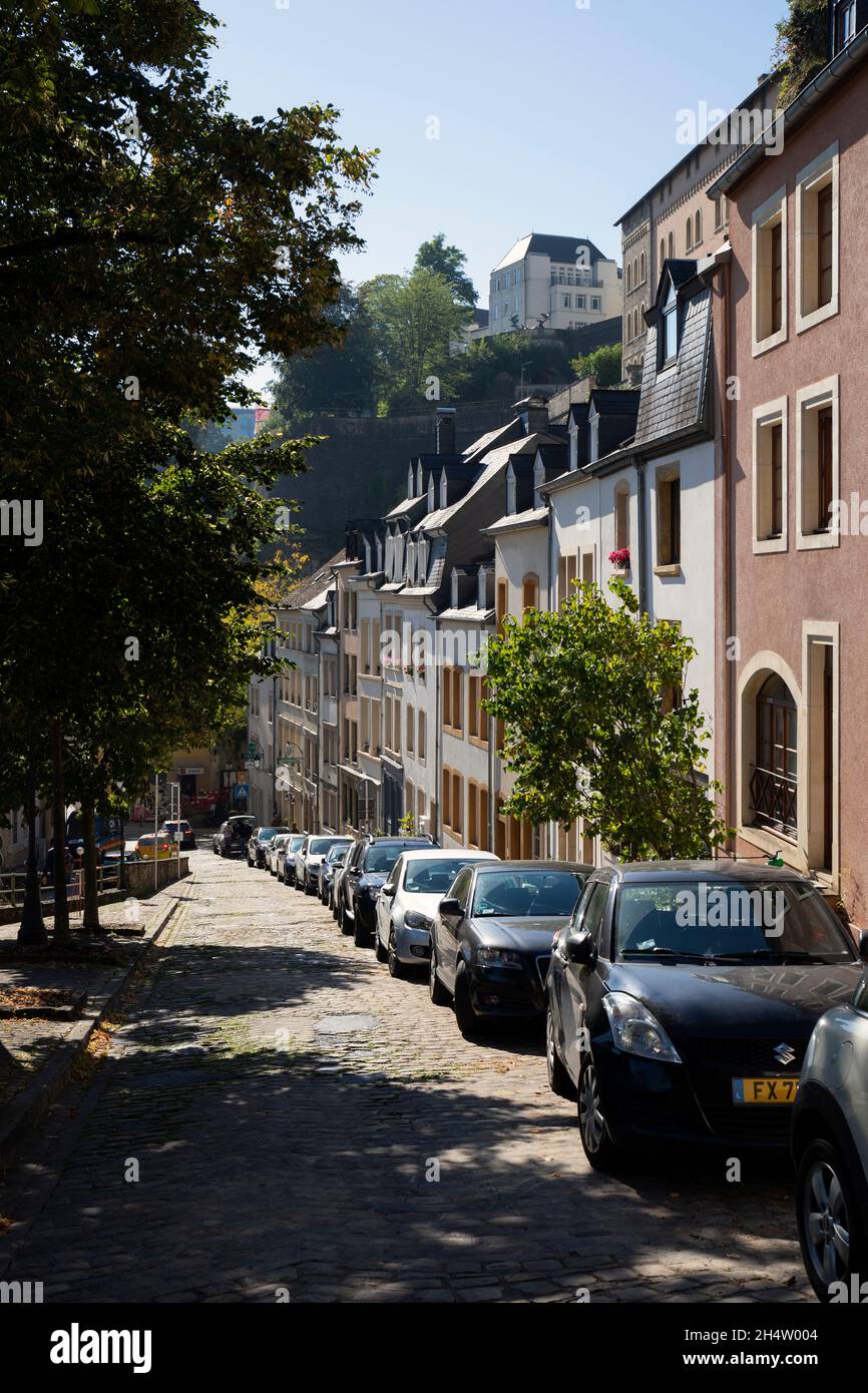 Europe, Luxembourg, Luxembourg City, Montée du Grund, Traditional Street with Houses and Parked Cars Stock Photo