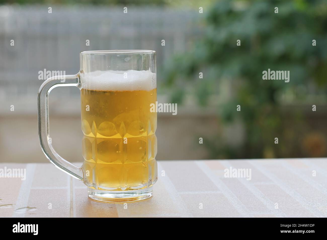 cold beer in glass with blurred background Stock Photo
