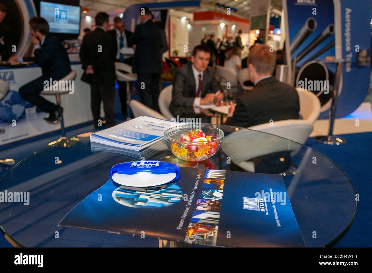 Trade stand at the Farnborough International Airshow 2014, trade show. Business meeting. TW Metals stall with brochure and sweets Stock Photo
