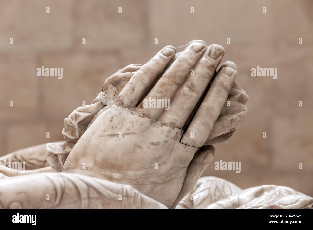 Detail of the hands of a marble statue Stock Photo