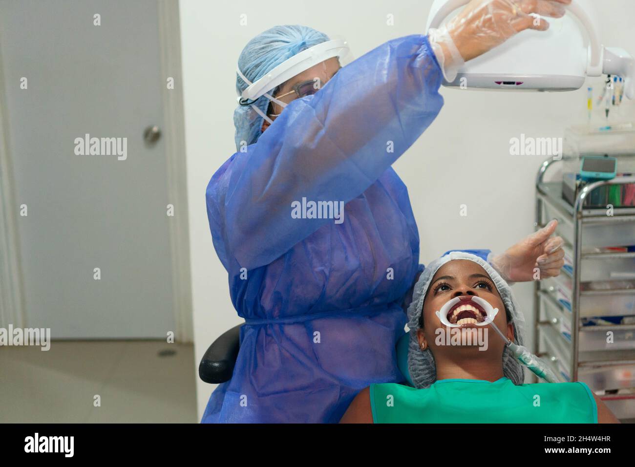 dentist checking her teeth at a dental exam. Stock Photo