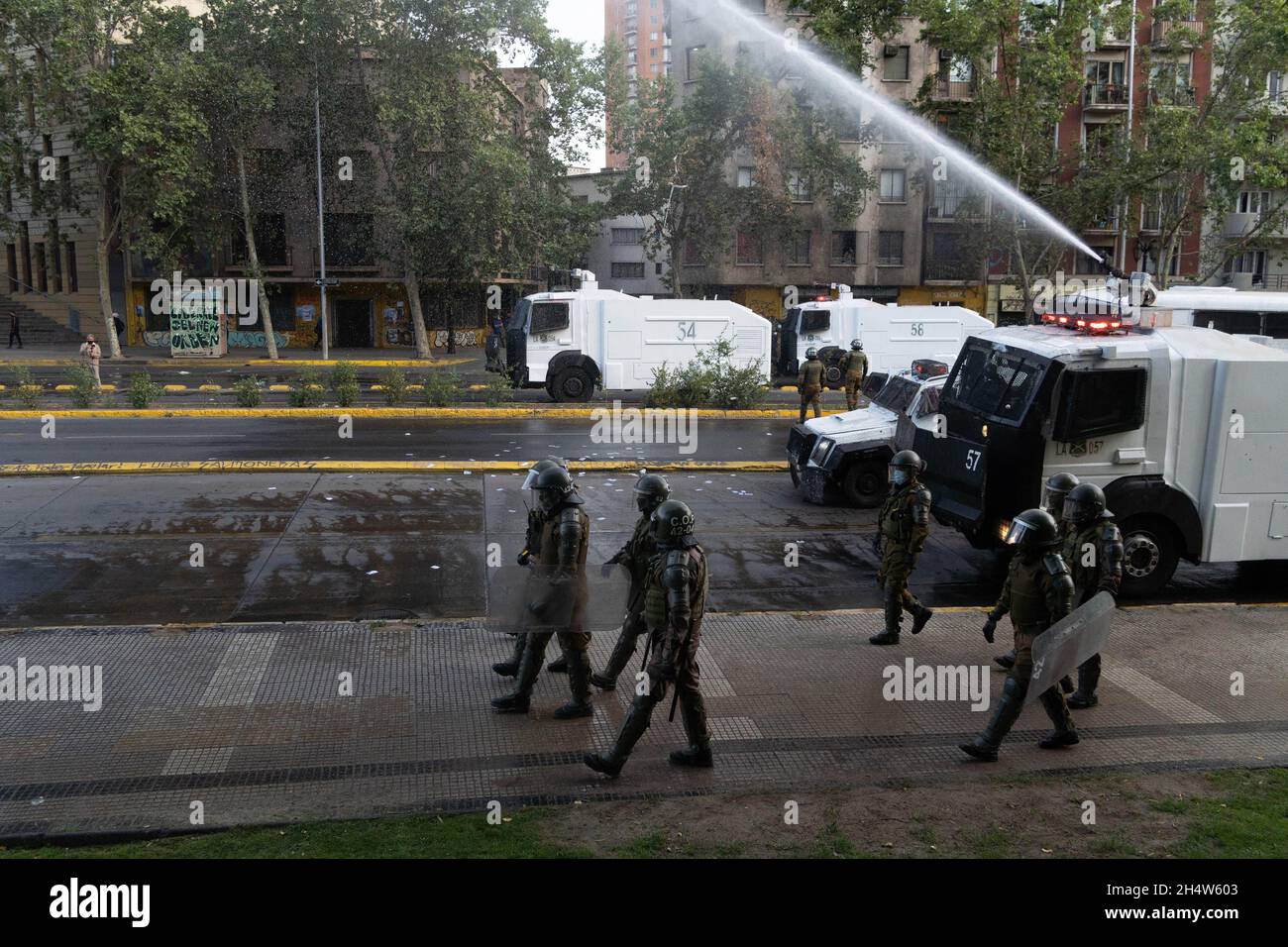 Santiago, Metropolitana, Chile. 4th Nov, 2021. Police disperse protesters with water cannon during protests against Sebastian Pinera government in Santiago, Chile. The protests come after the death of a Mapuche person during clashes in the southern region of Bio Bio after the Chilean government declared a state of emergency to reduce violence in that area of southern Chile. (Credit Image: © Matias Basualdo/ZUMA Press Wire) Stock Photo