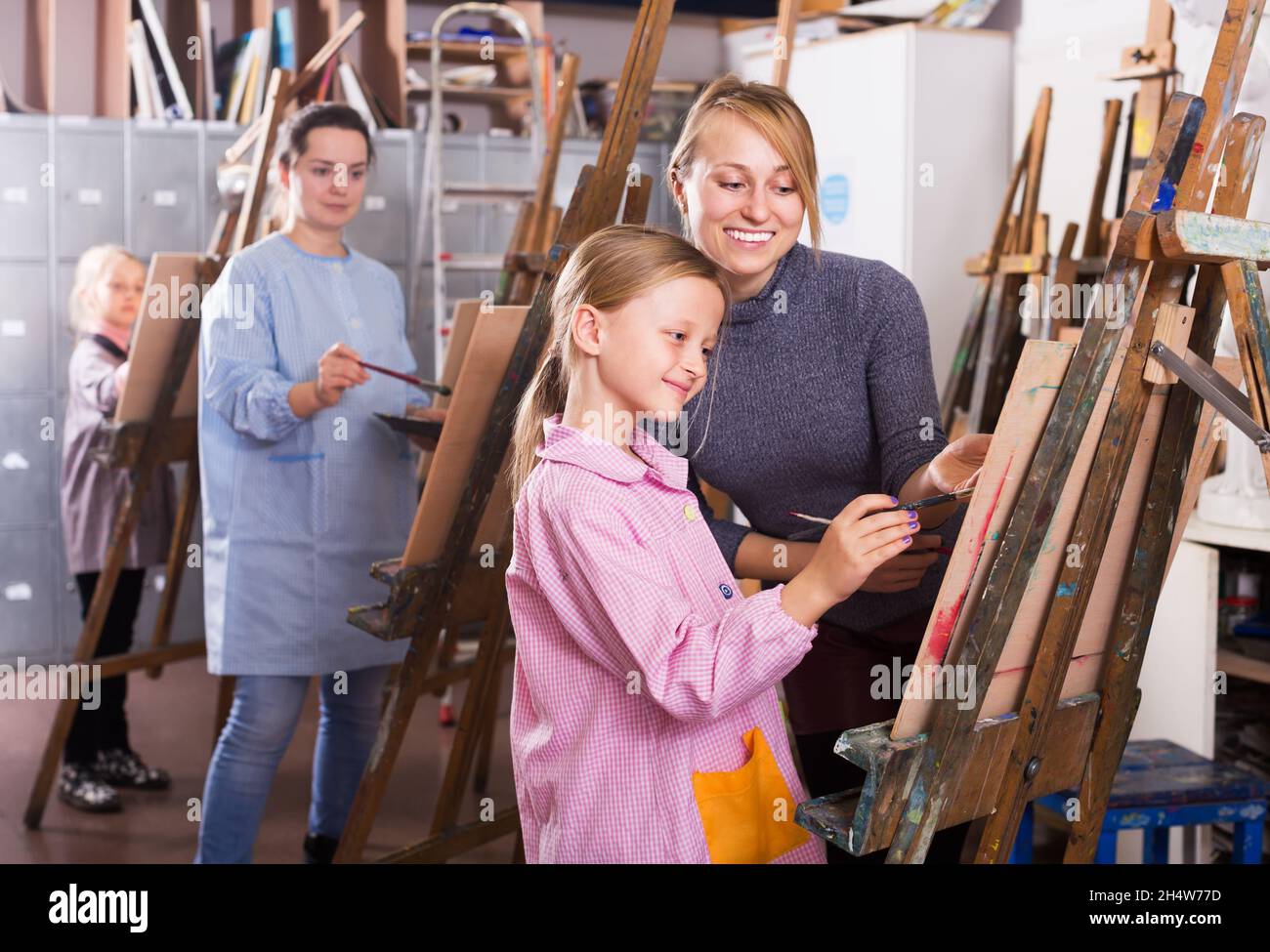 Girls working at painting class Stock Photo Alamy