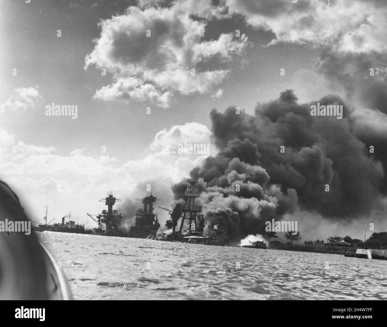 Photograph of the USS Arizona, the USS Tennessee, and the USS West Virginia after the Japanese Attack on Pearl Harbor Stock Photo
