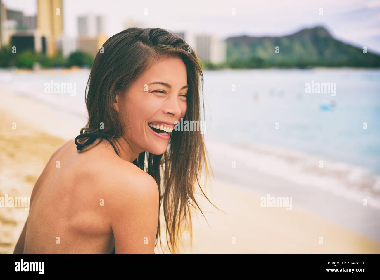 Hawaii beach vacation lifestyle laughing young Asian girl living the