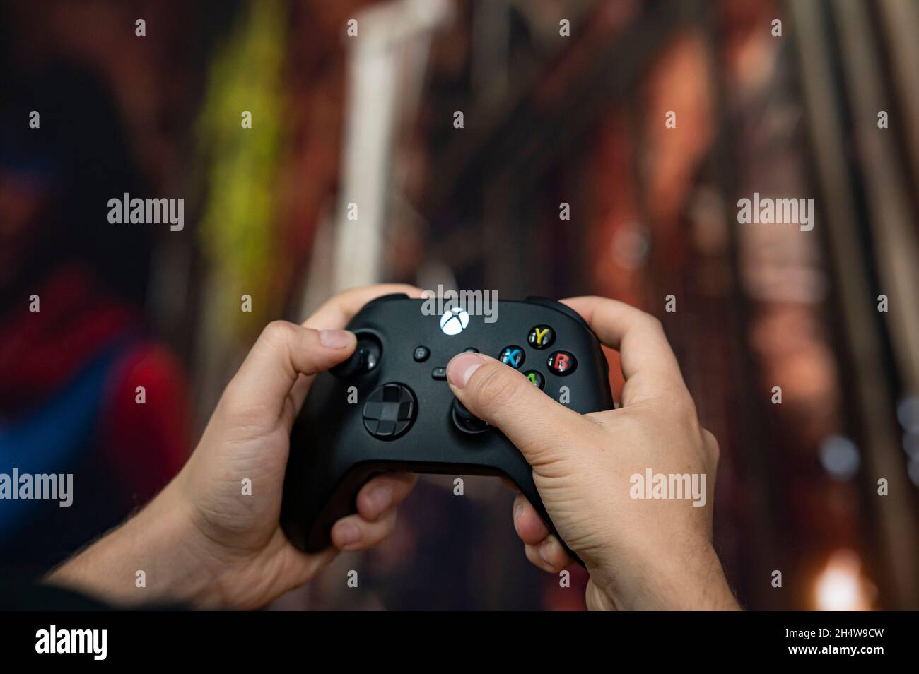 Berlin, Germany. 04th Nov, 2021. A man holds a controller of the Xbox  Series X gaming console. Playstation 5 and Xbox Series X have been on the  market for a year, but