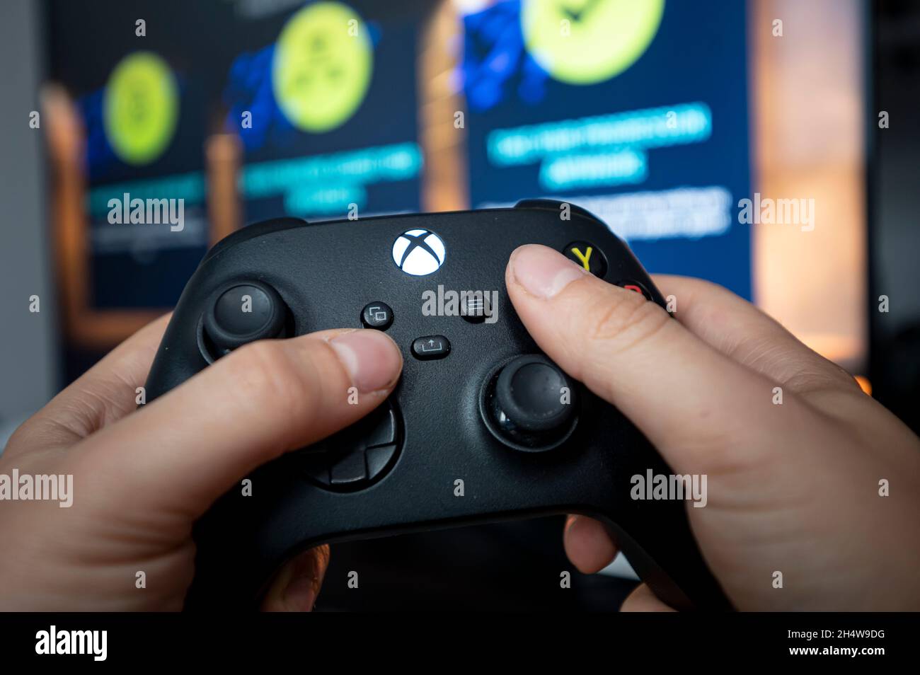 Berlin, Germany. 04th Nov, 2021. A man holds a controller of the Xbox  Series X gaming console. Playstation 5 and Xbox Series X have been on the  market for a year, but