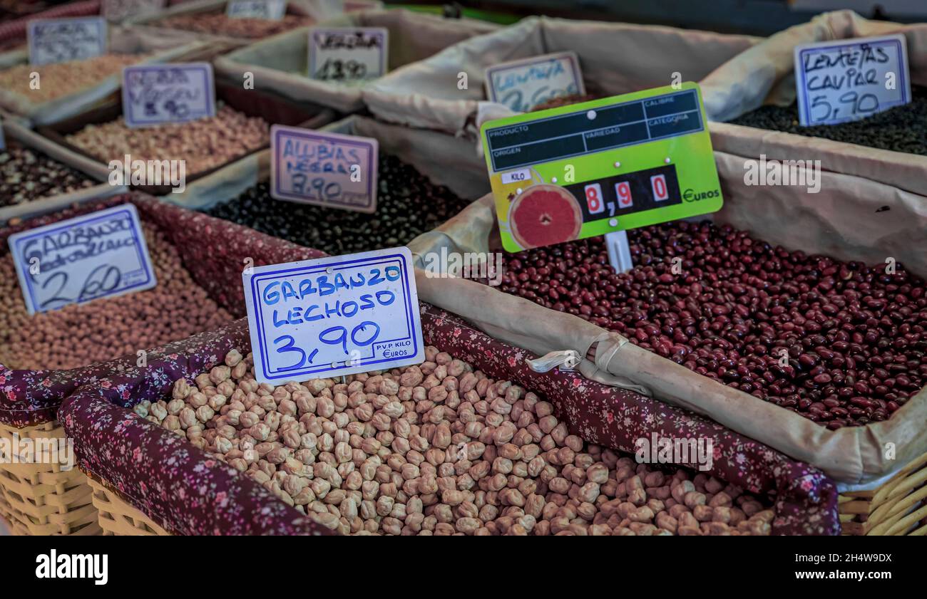 Garbanzo beans and kidney beans on display at a market stall in