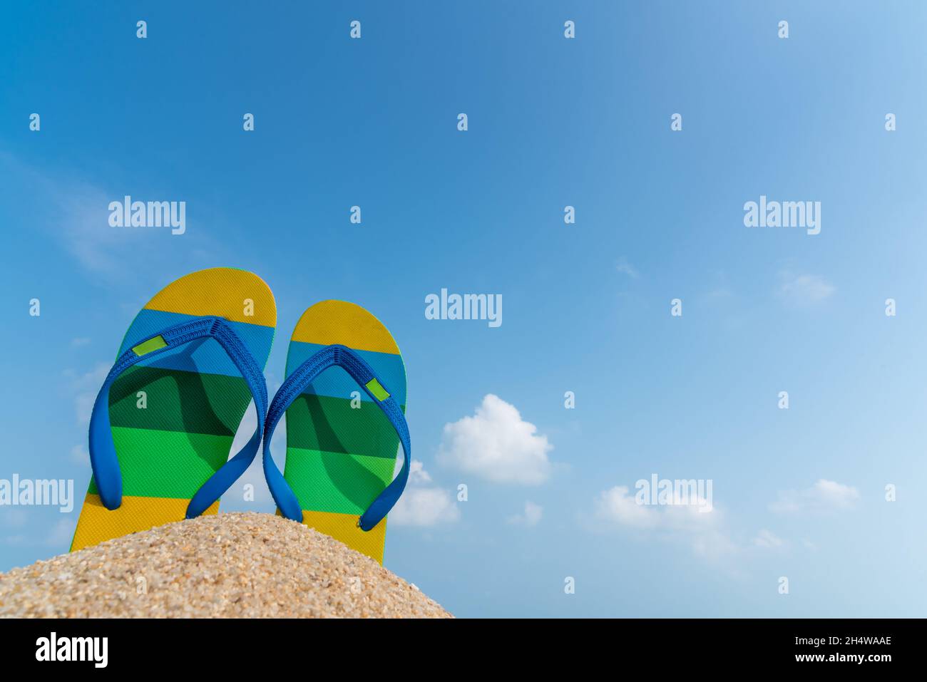 Beach sandals on the sandy coast. Summer concept Stock Photo - Alamy