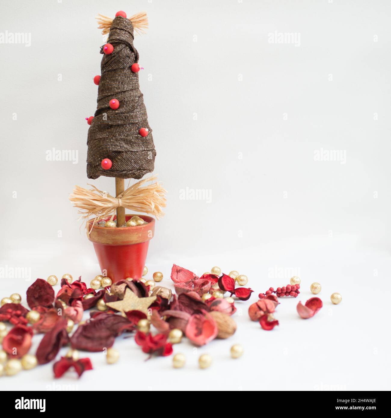 Christmas tree and red potpourri with white background Stock Photo Alamy