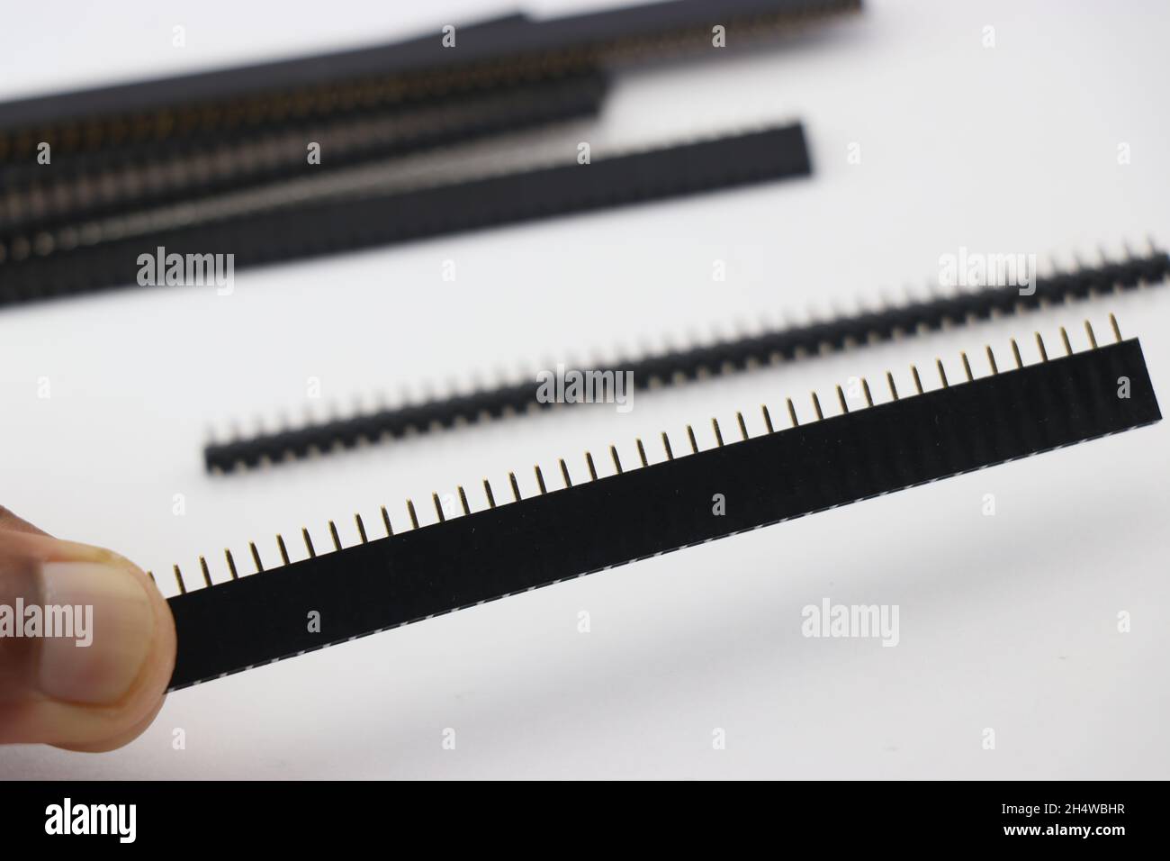 Female header pins in a single row held in hand connectors used in