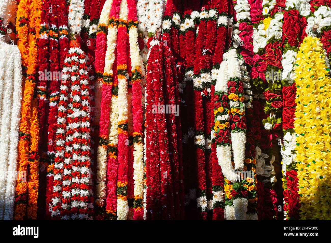 27.10.2021, Singapore, Republic of Singapore, Asia - Decorative ornaments and colourful flower garlands are displayed for sale in Little India. Stock Photo