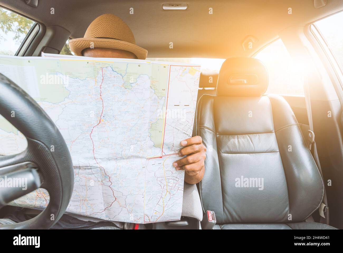 Man look at the map inside car Stock Photo