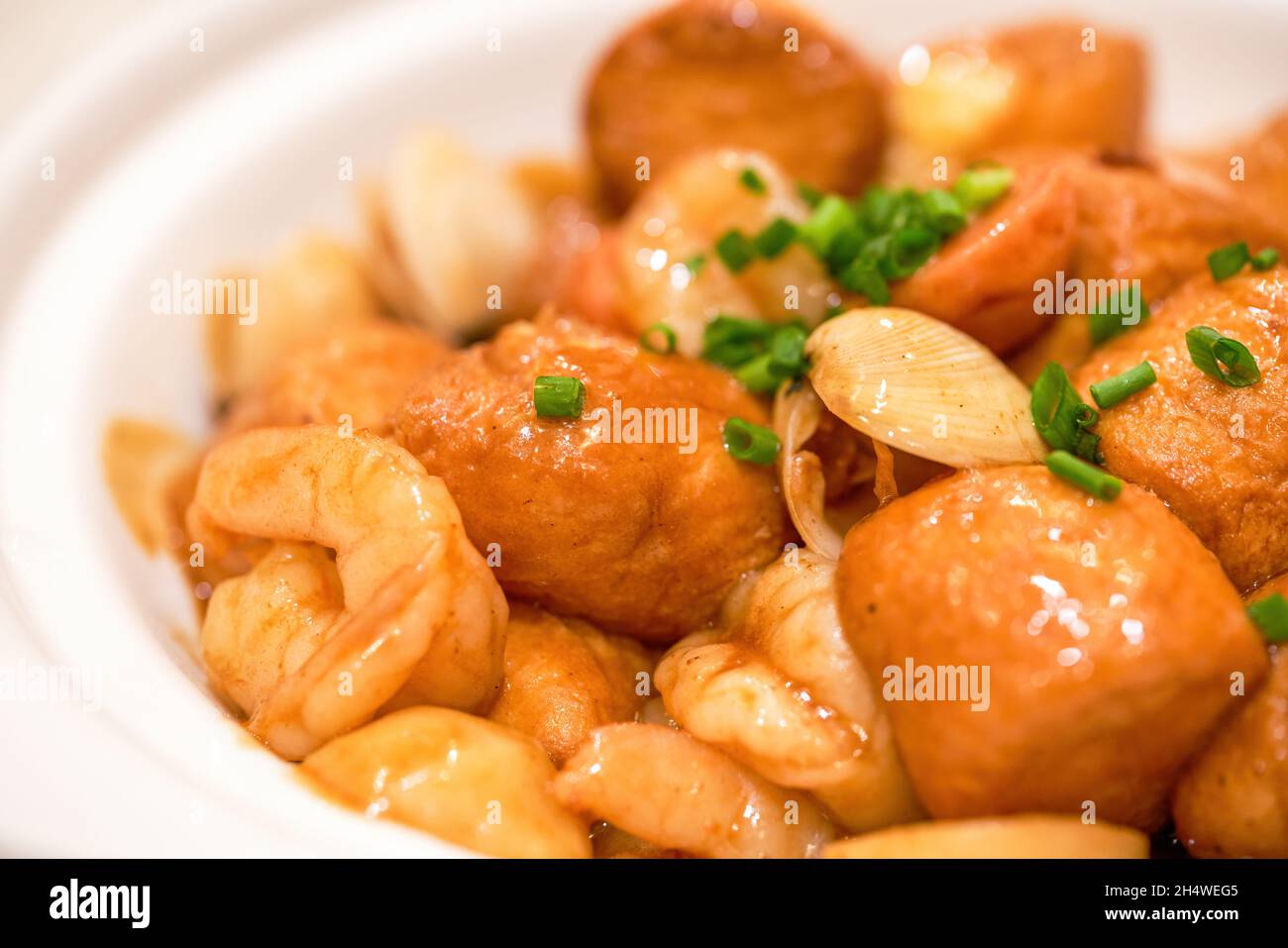 A delicious Chinese dish, shrimp, seafood braised egg tofu in clay pot Stock Photo