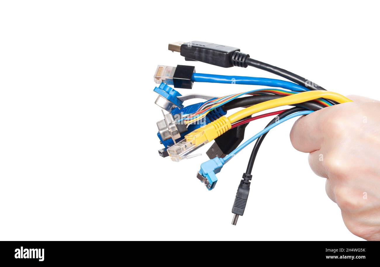 Bunch of computer cables in women's hand isolated on white background