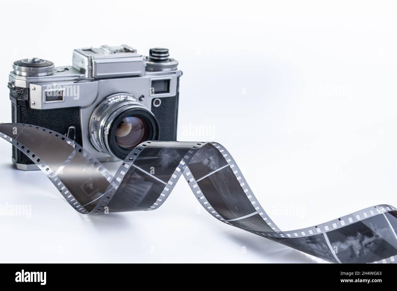still life with retro camera, camera roll and cassettes on wood background Stock Photo