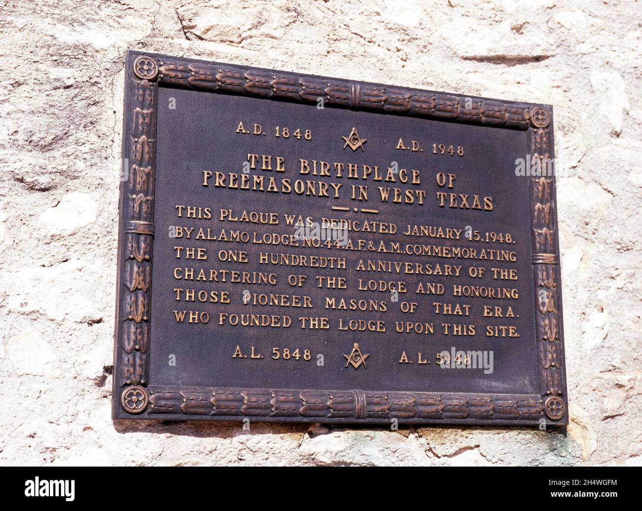 Plaque honouring Masons on the Alamo wall, San Antonio, Texas, USA. Stock Photo