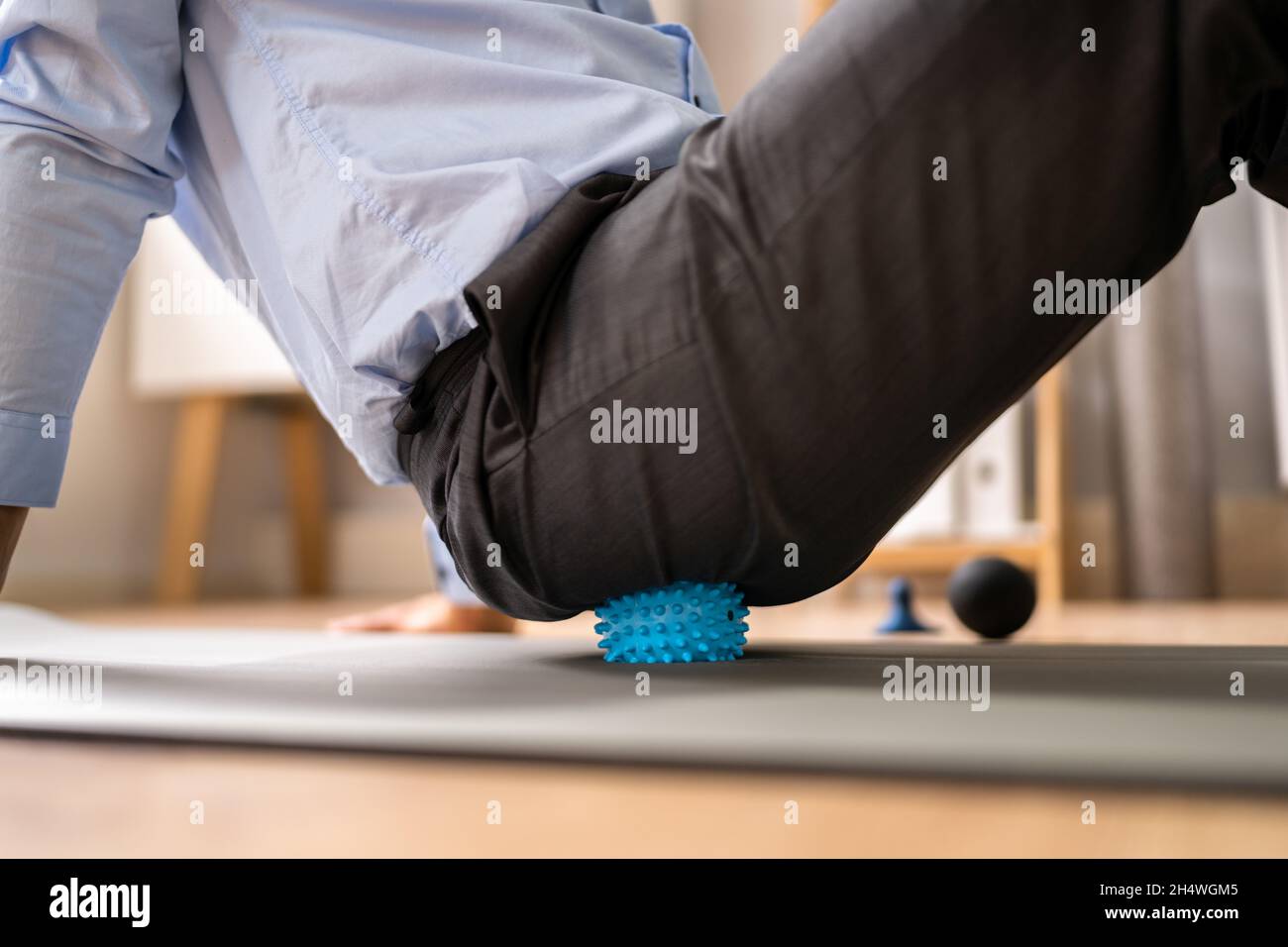 Glutes Trigger Point Massage Using Spiky Ball Myofascial Release Stock