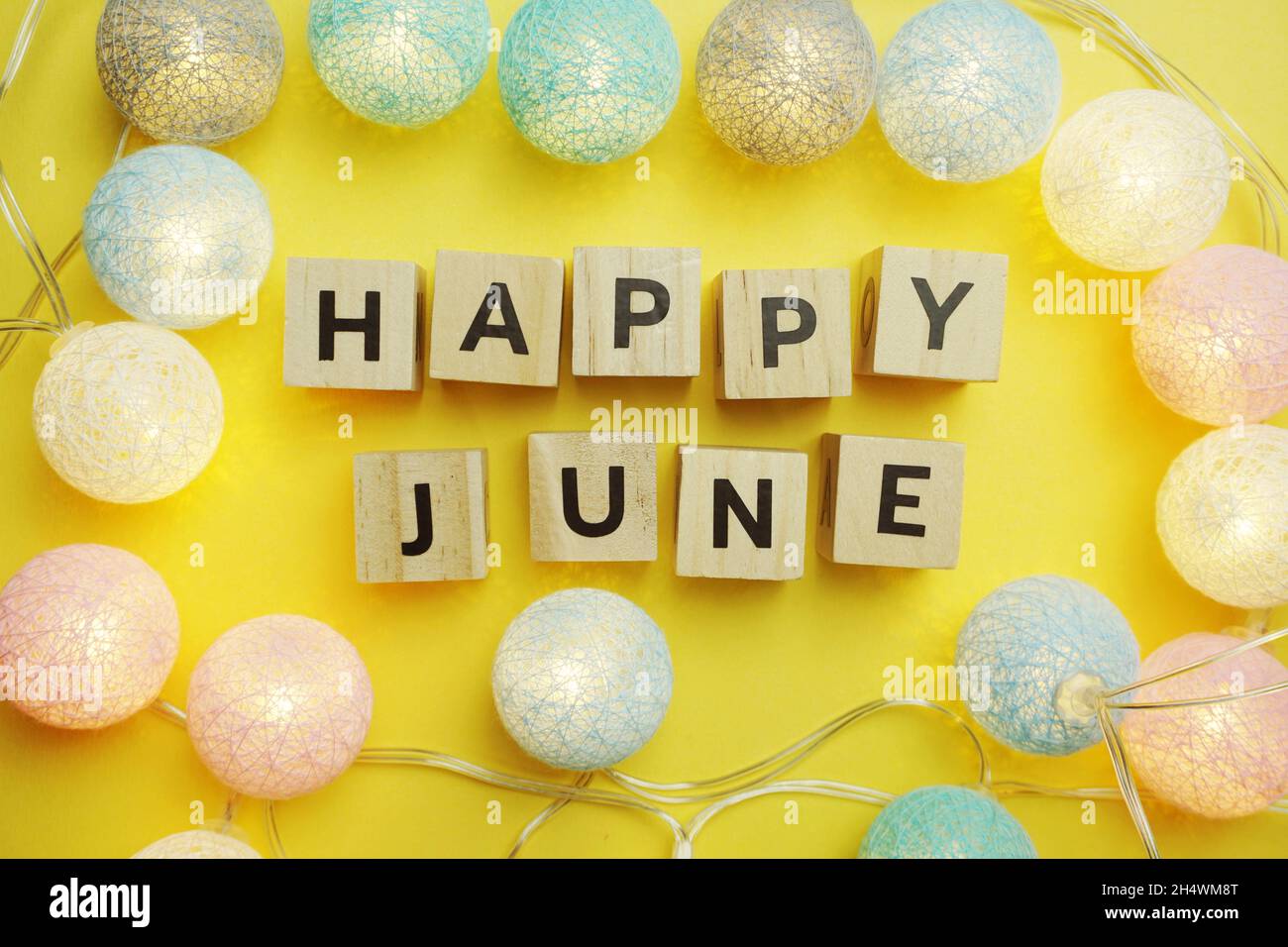 Happy June alphabet letter with LED Cotton ball Decoration on yellow  background Stock Photo - Alamy