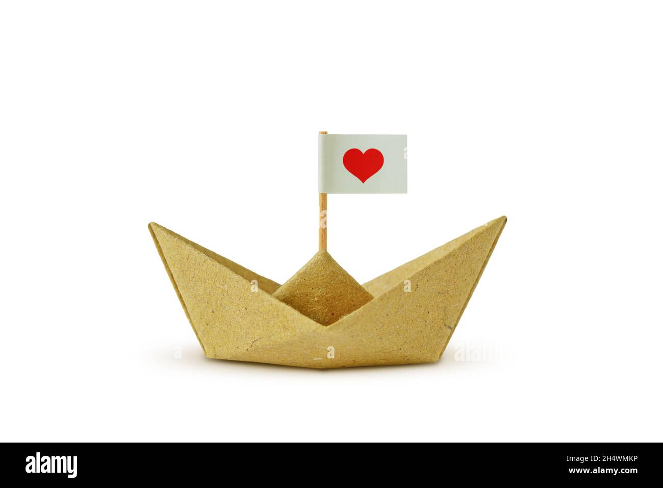 Origami boat made of recycled paper with flag and heart - Concept of immigration and solidarity Stock Photo