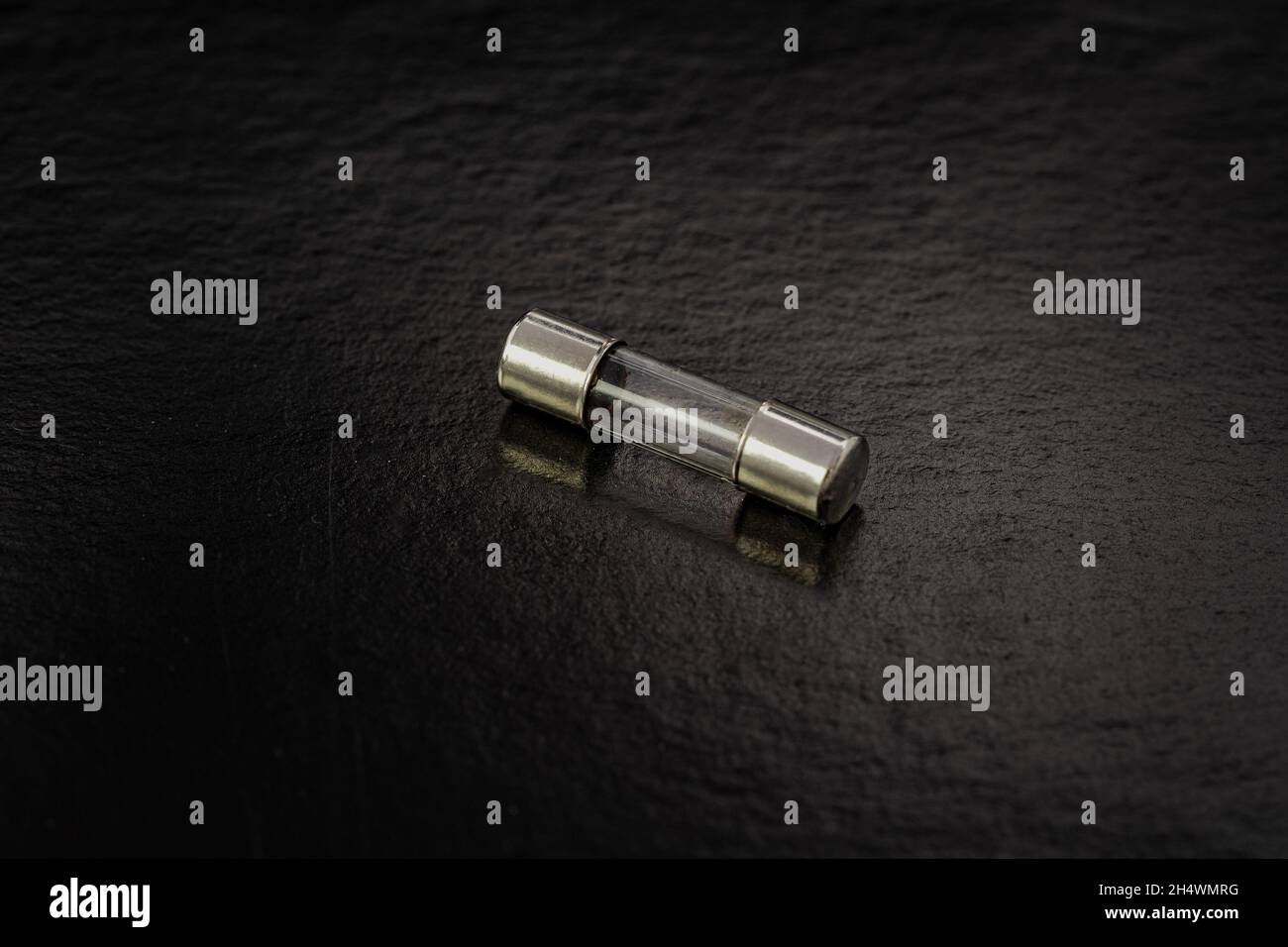 Blown cartridge electrical fuse on a black background Stock Photo Alamy