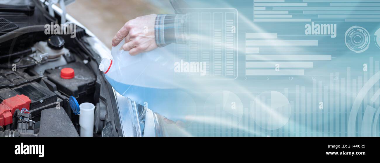 Hands of mechanic pouring blue windshield washer fluid in a car; panoramic banner Stock Photo