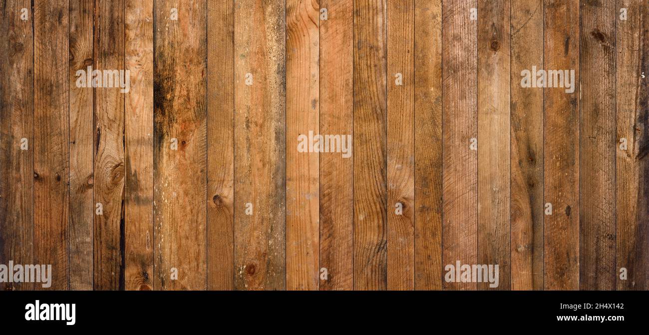 Old barn wood background texture. Vintage weathered rough planks wall backdrop. Stock Photo