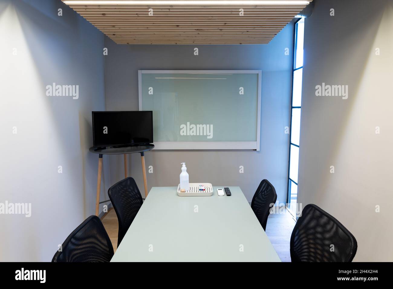 Empty chairs in board room with copy space on screens at office Stock Photo